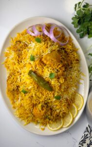 A rice and chicken recipe made with spices blend, tomatoes and rice named Pakistani biryani
