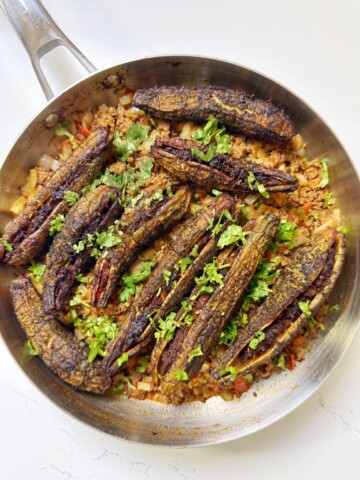 bitter gourds are stuffed with ground beef and then fried